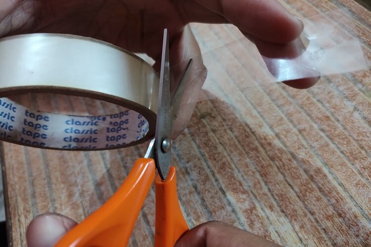cut small length of tape for film removal step 2